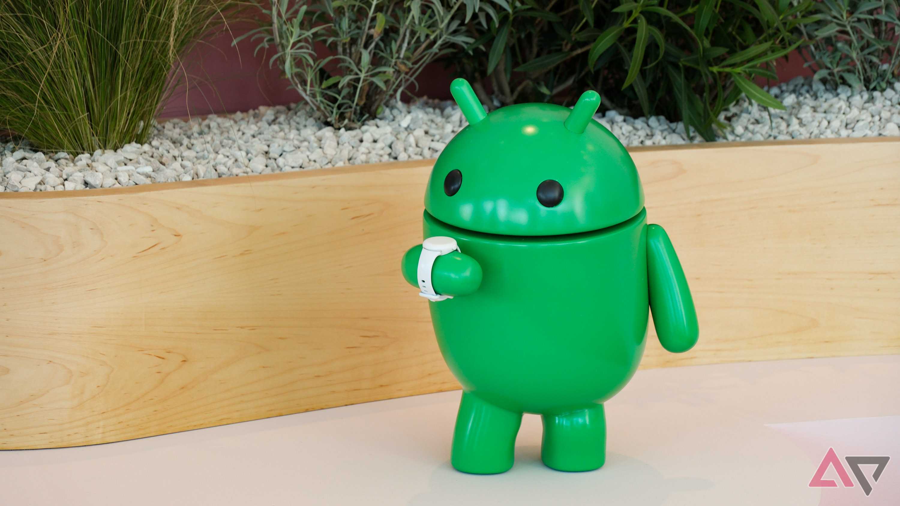 An Android bot checking it's WearOS smartwatch