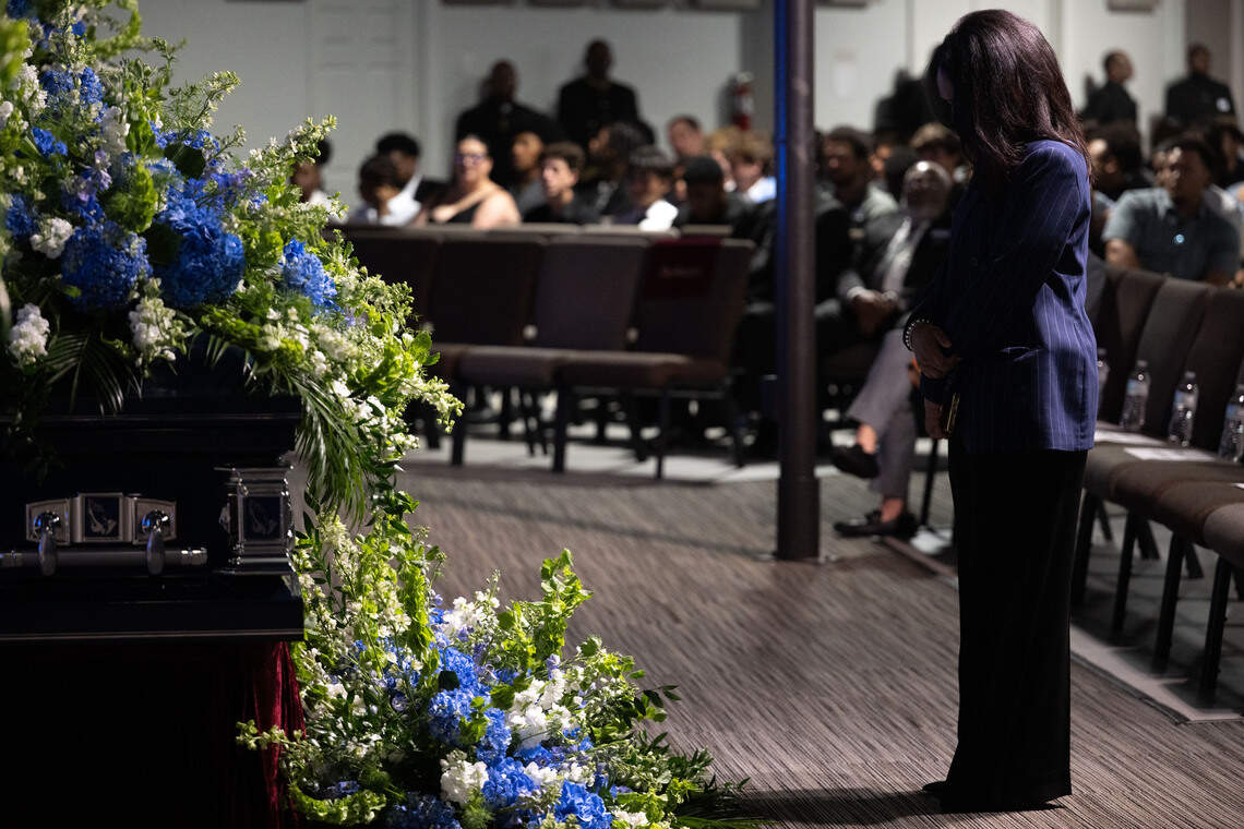 A woman lowers her head as she stands in front of Nolan Wells’ casket during Wells’ funeral service at Center Pointe Church in Ocean Springs on Monday, July 20, 2026.