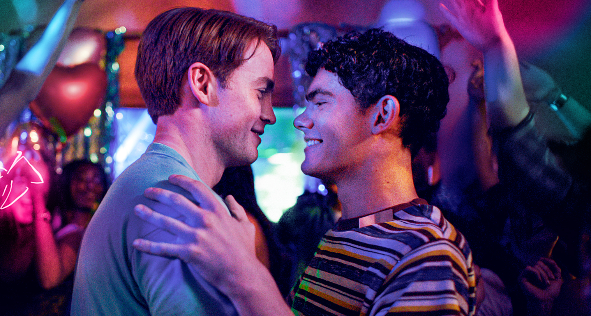 kit connor and joe locke embrace at a party on a dancefloor in a first look image at the heartstopper finale movie heartstopper forever