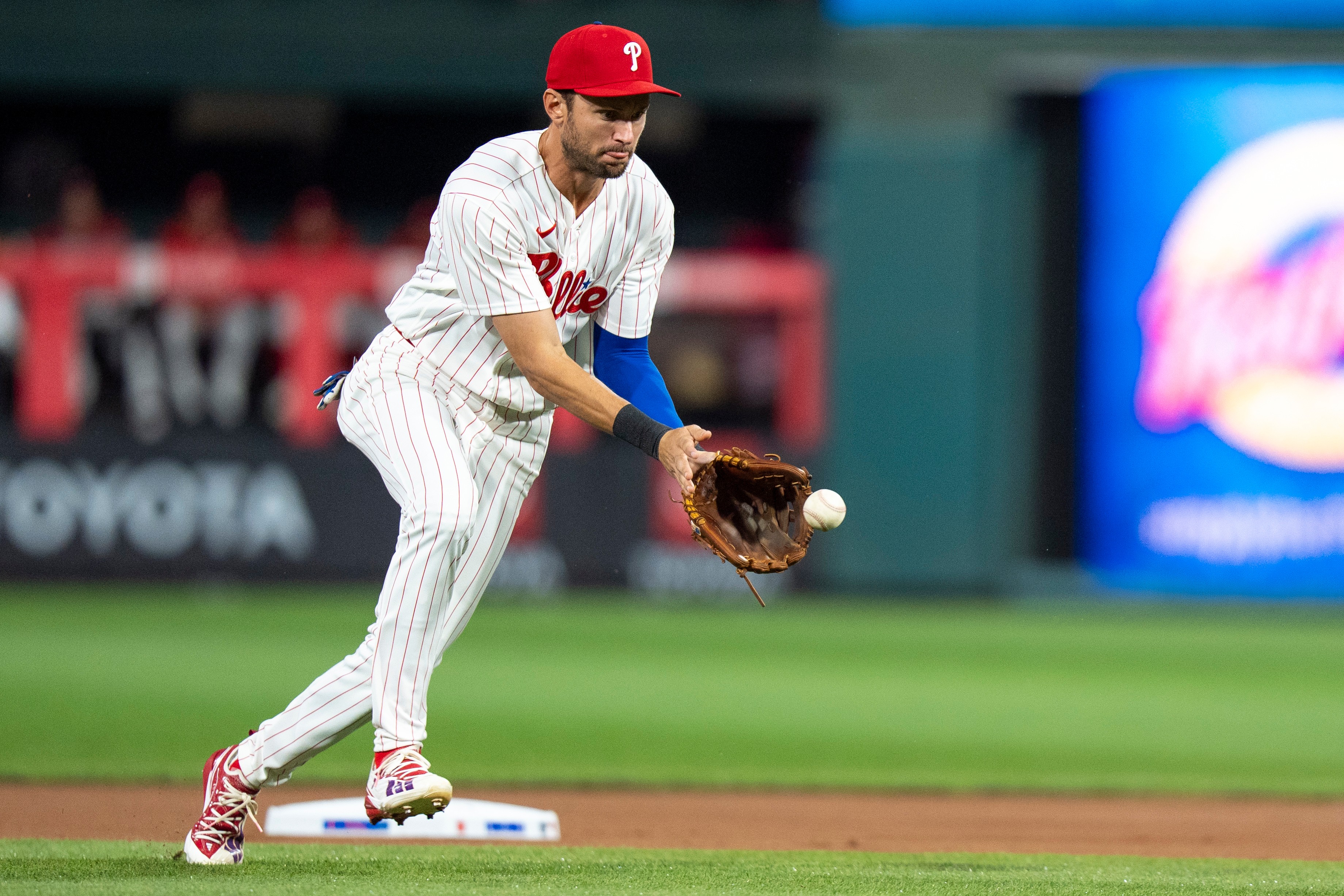 Philadelphia Phillies shortstop Trea Turner fields the ground ball by Los Angeles Dodgers' Freddie Freeman during the first inning of a baseball game, Tuesday, July 21, 2026, in Philadelphia. (AP Photo/Chris Szagola)