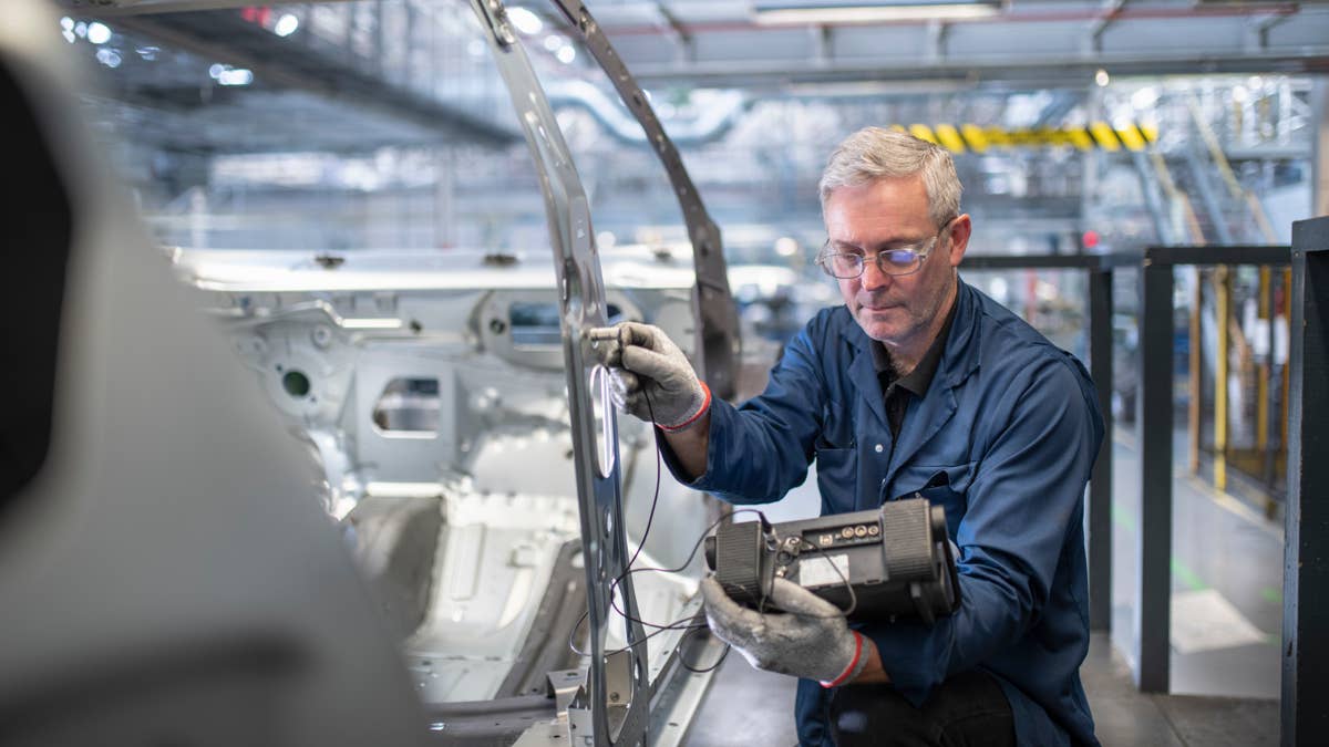 engineer-testing-car-body-in-car-factory