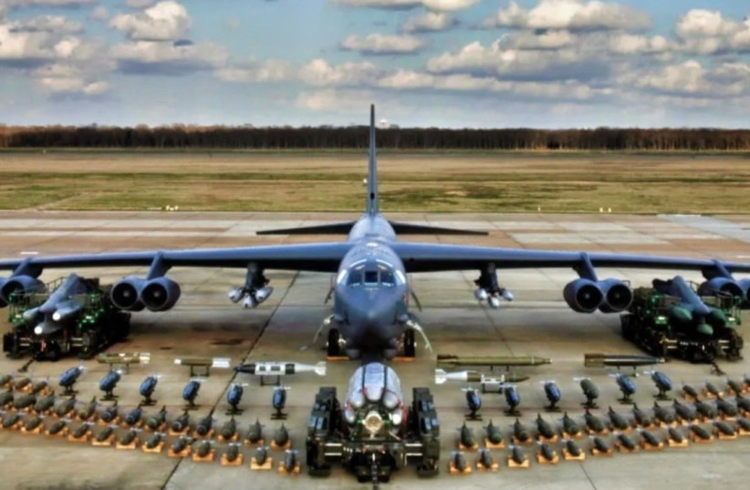 US Air Force B-52H Stratofortress with its full weapons capability display laid out on a tarmac. (credit: Screenshot/X/BLT)