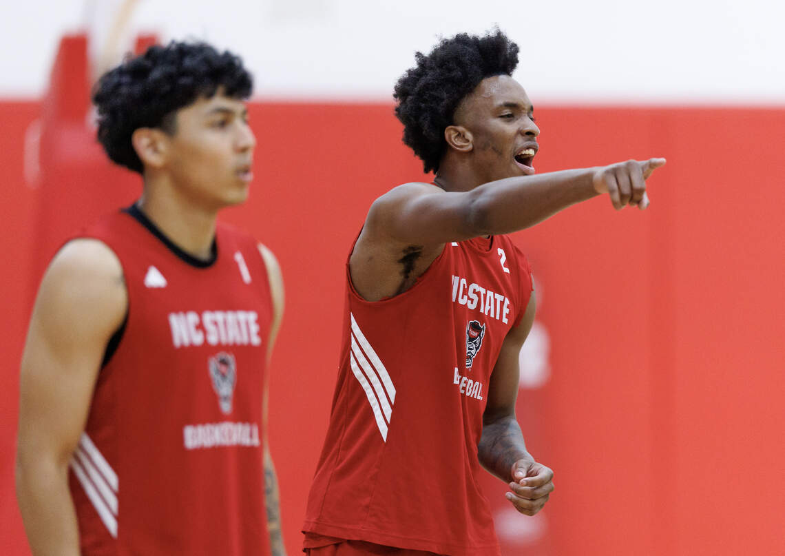 N.C. State’s Paul McNeil Jr., right, talks with teammates during a workout at the Dail Basketball Center on Tuesday, July 21, 2026, in Raleigh, N.C.
