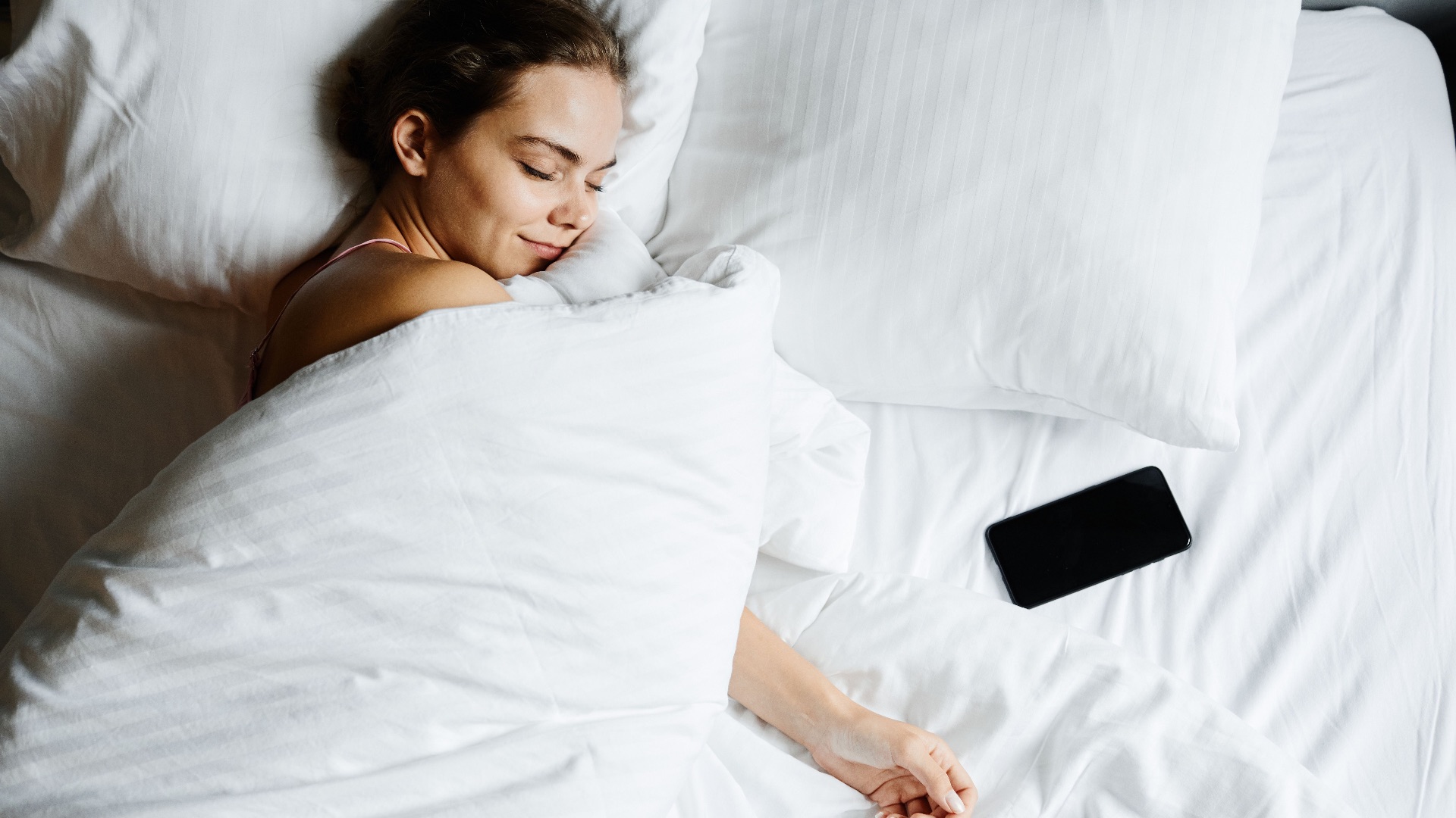Here's Why You Shouldn't Sleep with Your Phone by Your Pillow