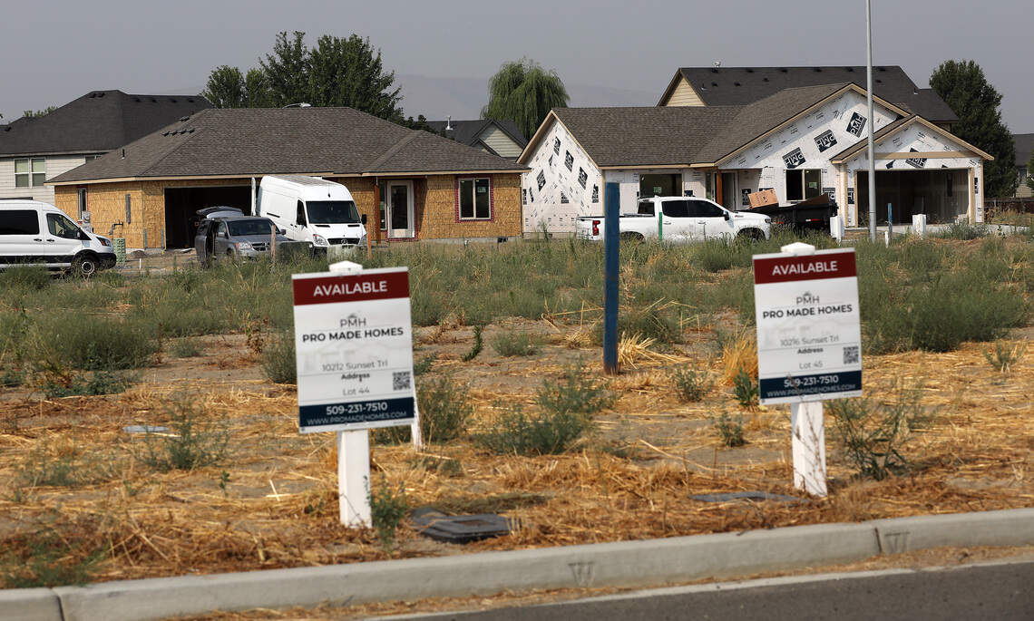 New homes under construction and empty lots are available on Sunset Trail and Redbud Drive in a new housing development near Road 104 in Pasco.
