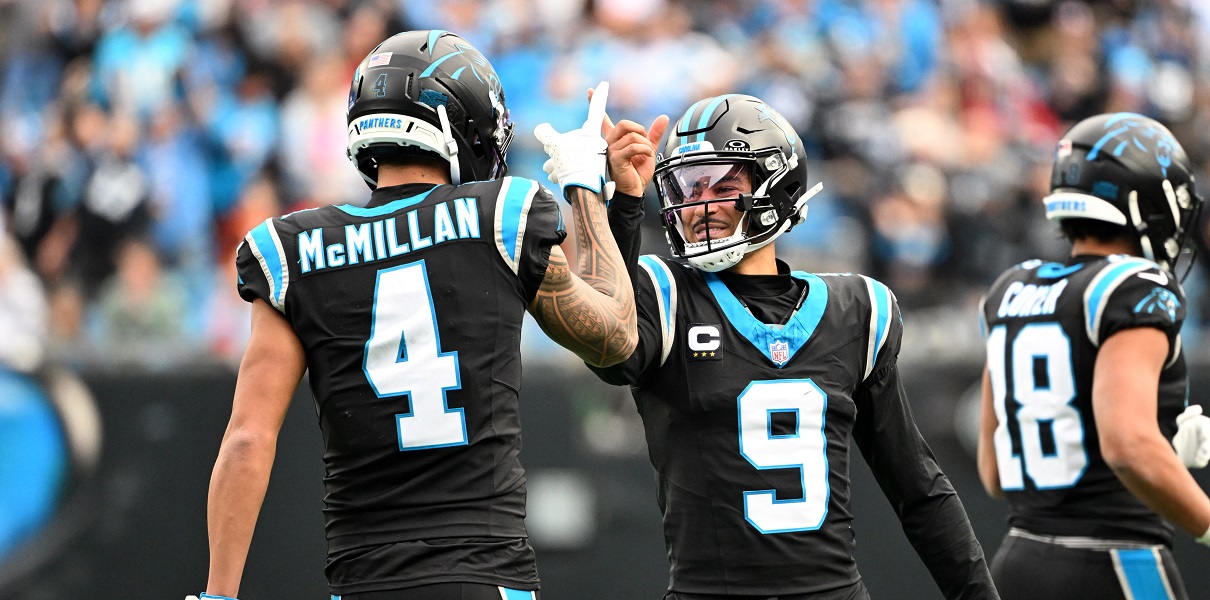Dec 21, 2025; Charlotte, North Carolina, USA; Panthers QB Bryce Young celebrates with WR Tetairoa McMillan after a play against the Buccaneers at Bank of America Stadium. Mandatory Credit: Bob Donnan-Imagn Images