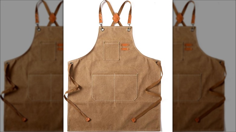 Brown Tosewever canvas apron on white background