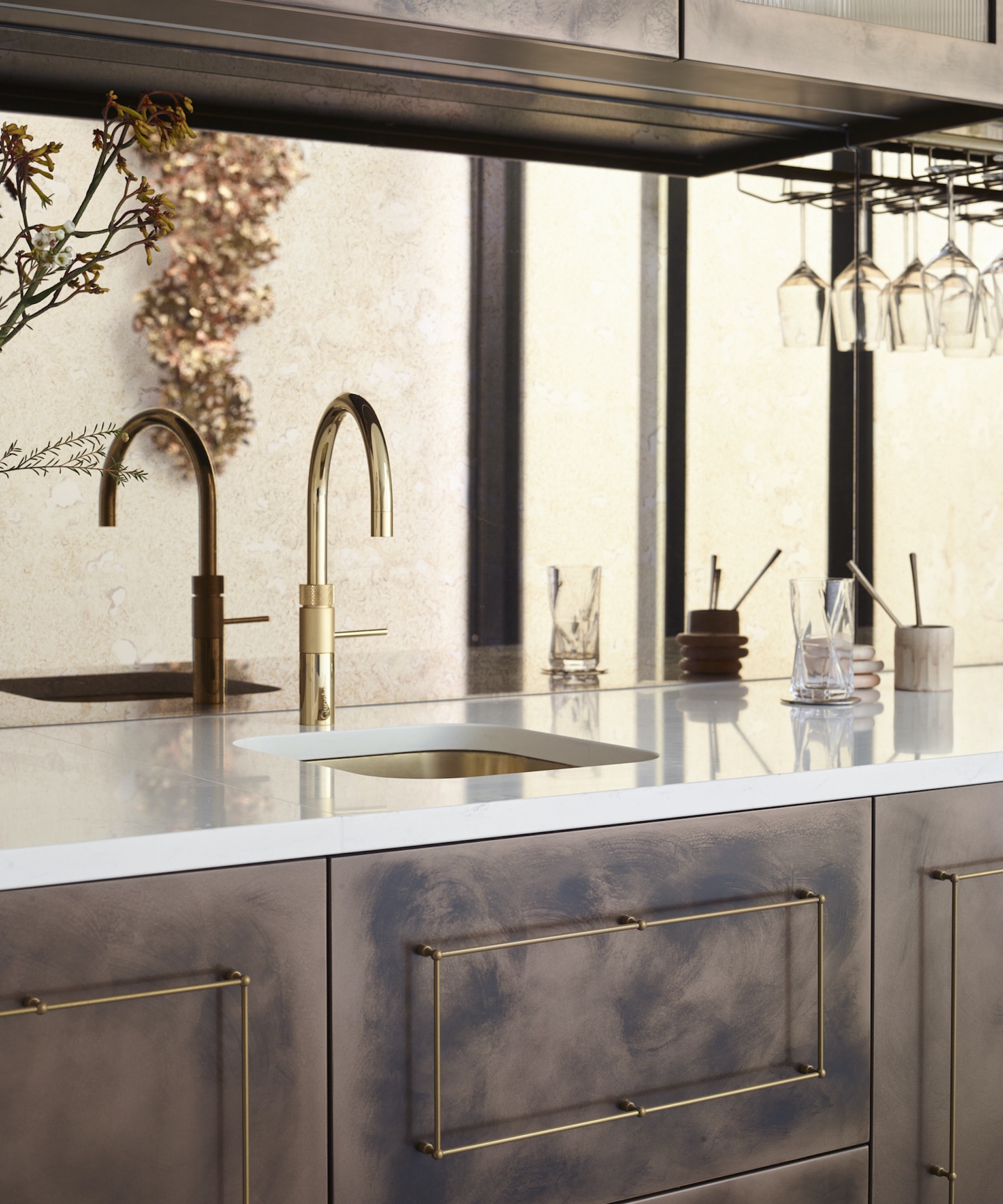 brass prep sink in metallic cabinets with brass quooker
