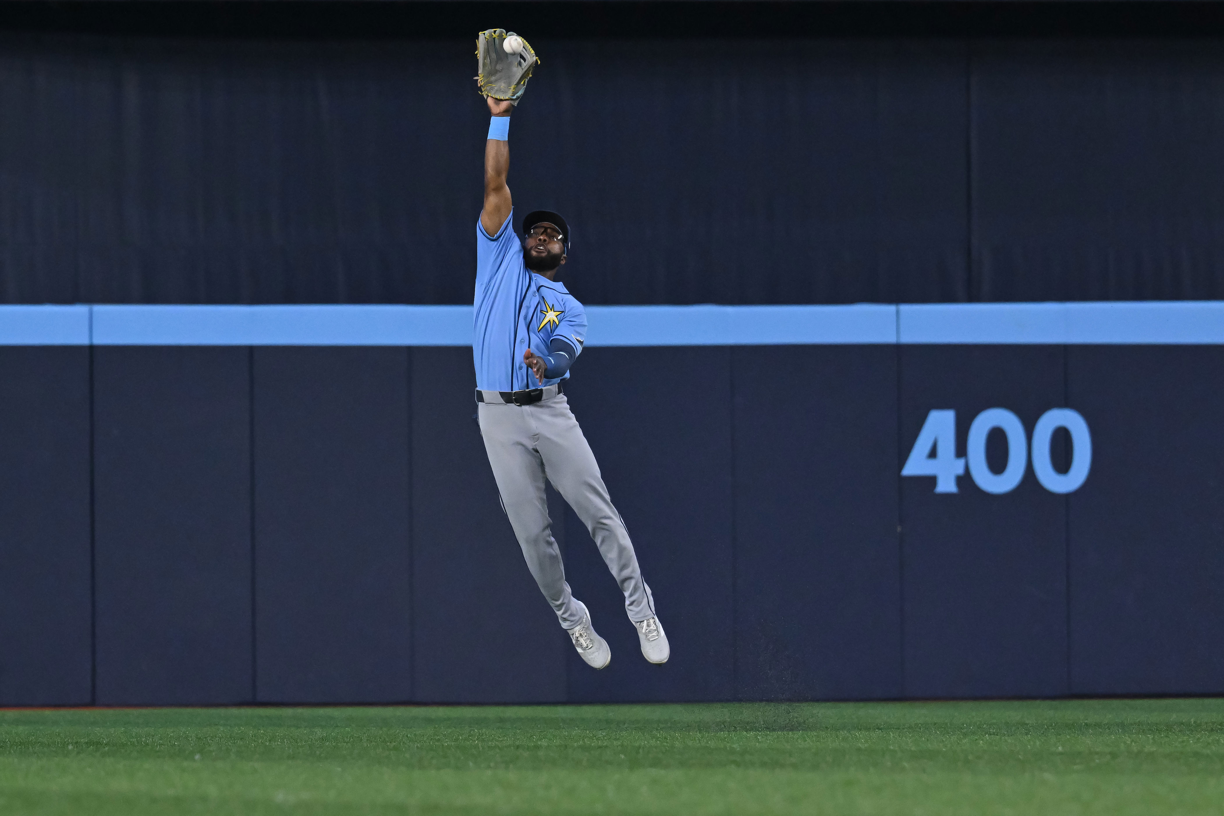 Tampa Bay Rays centre fielder Cedric Mullins (31) fields a ball off the bat of Toronto Blue Jays' Ernie Clement for a single during the first inning of a baseball game in Toronto on Tuesday, July 21, 2026. (Jon Blacker/The Canadian Press via AP)