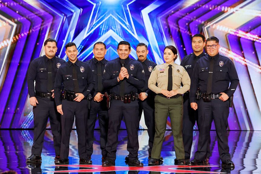 Los Servidores standing on stage during America's Got Talent Season 21 Episode 7.