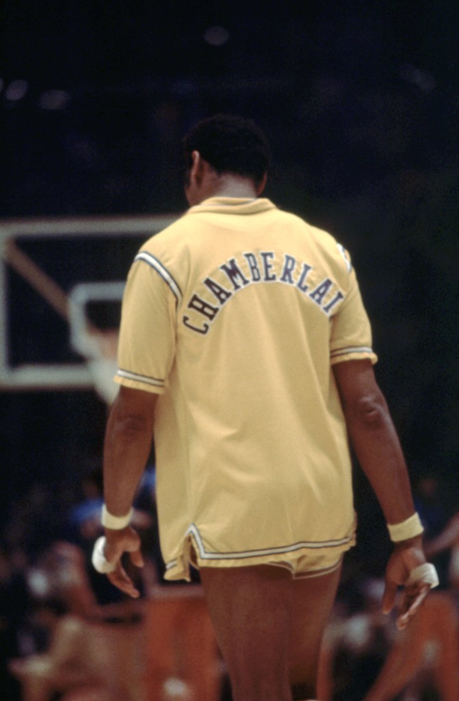 INGLEWOOD, CA - 1972: Wilt Chamberlain #13 of the Los Angeles Lakers walks on the court before an NBA game against the New York Knicks circa 1972 at The Forum in Inglewood, California. (Photo by Martin Mills/Getty Images)
