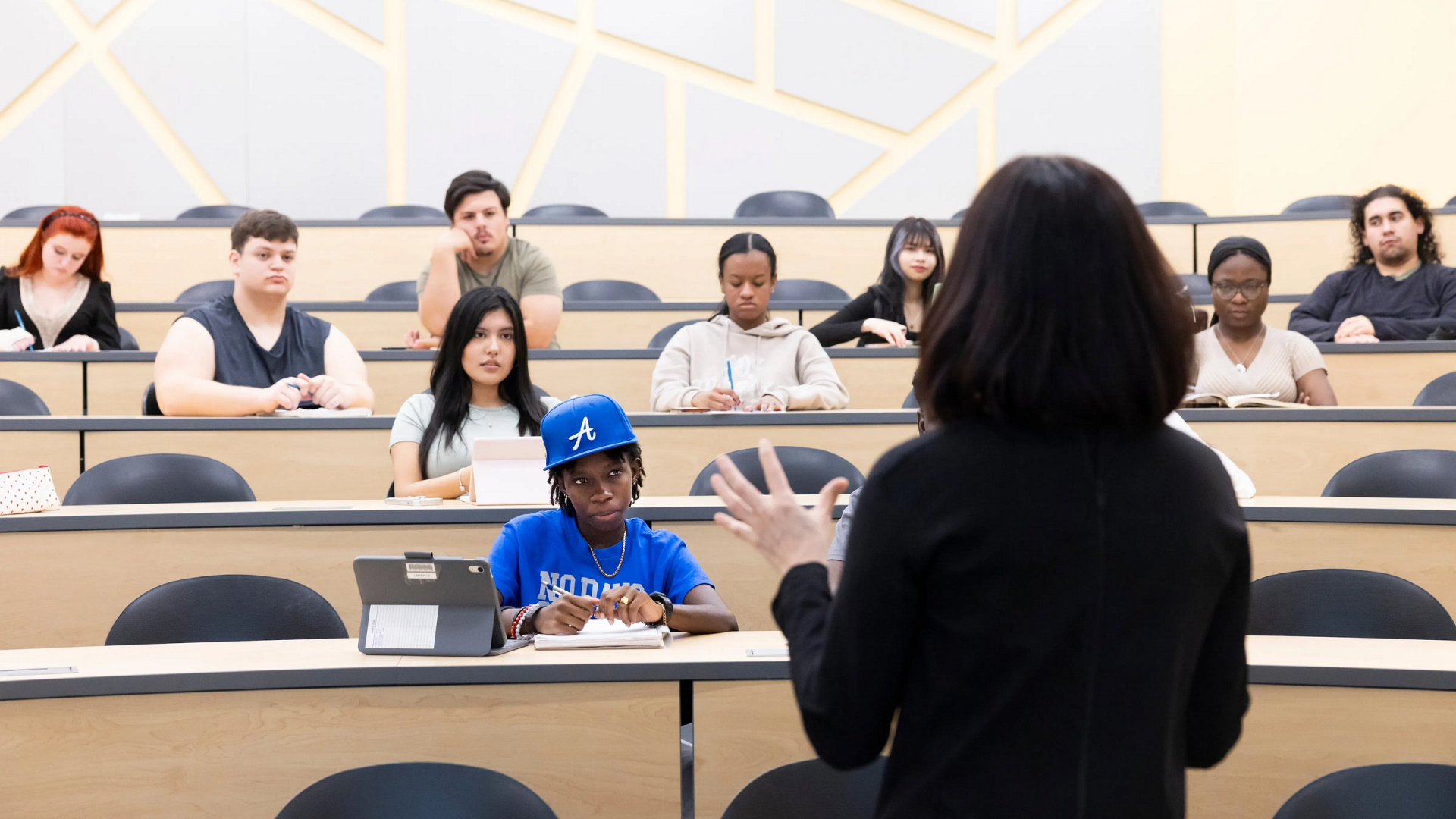 Students listen and take notes in a college lecture hall. Photo: Allison Shelley / Complete College Photo Library / CC BY-NC 4.0 / Cropped from Original