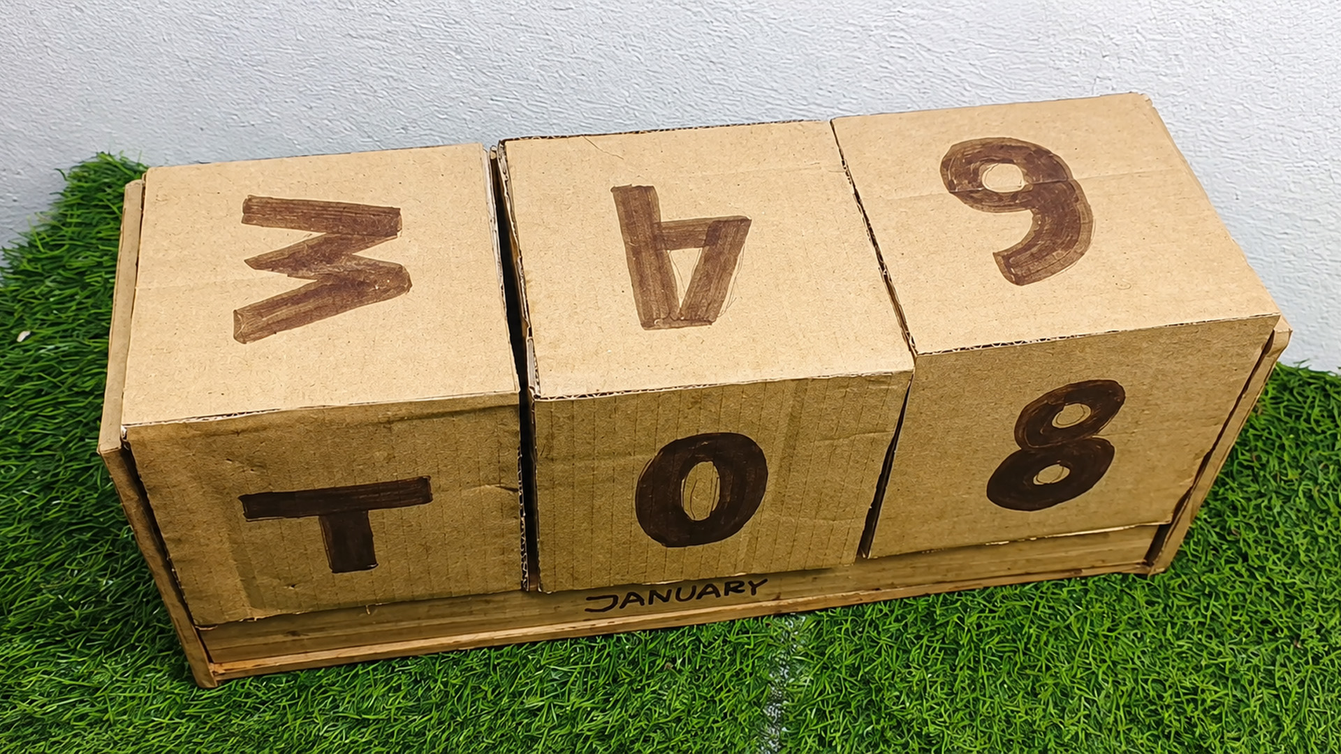 DIY cardboard table calendar from waste materials