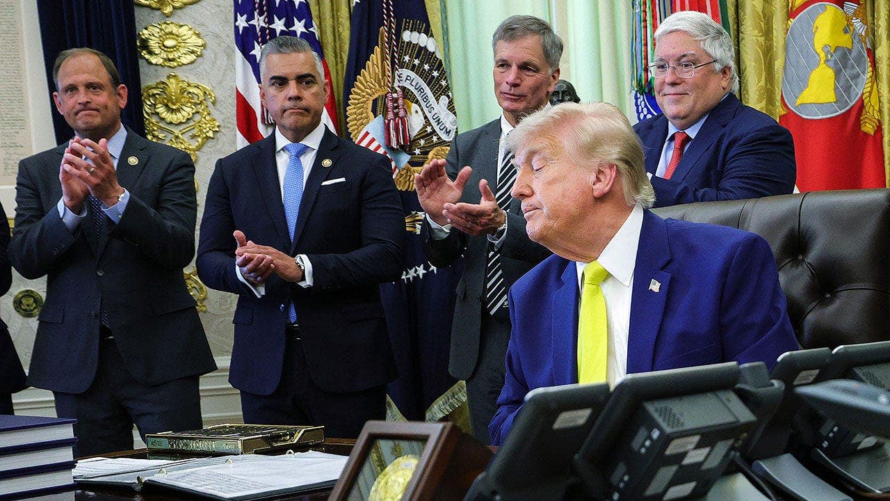 Juan Ciscomani applauds in the Oval Office at the White House.