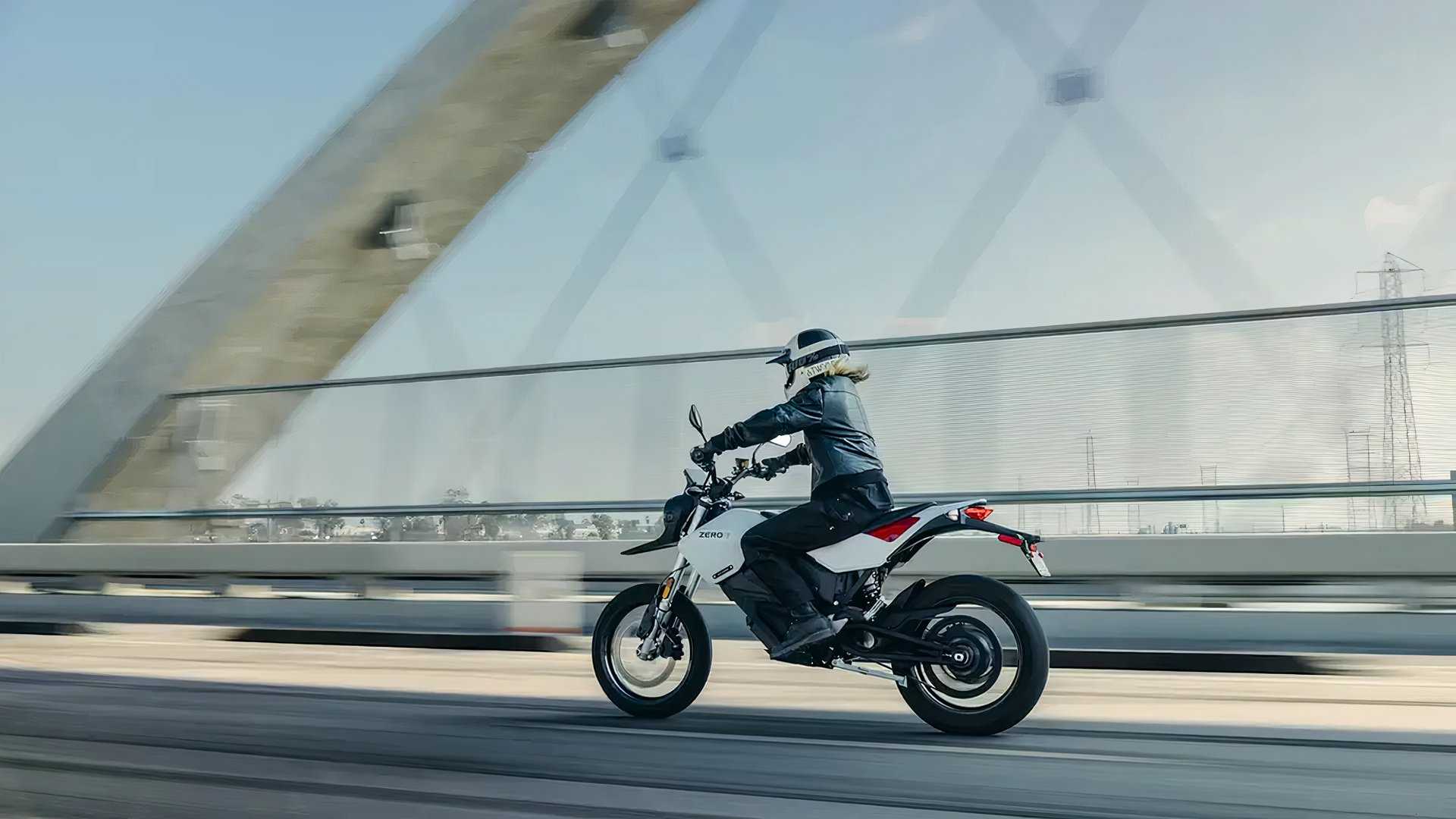 Zero FXE action shot of rider on a bridge