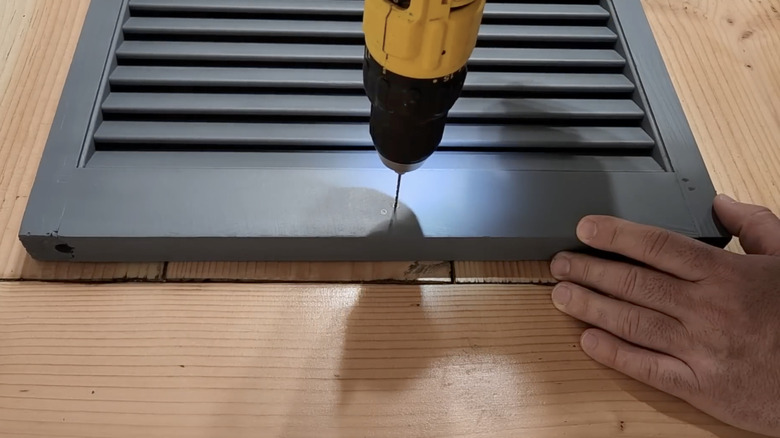 There's no need to buy a privacy screen when you can easily DIY one with shutters