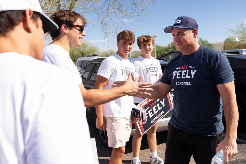 Voters and politicians head to the polls during Arizona's primary election