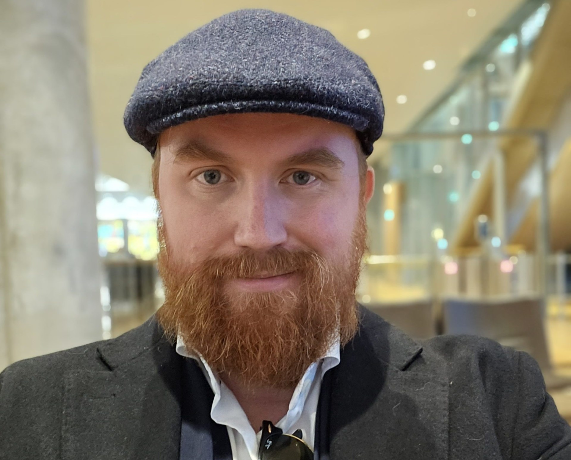 Bjorn wearing a flat cap. He looks directly at the camera.