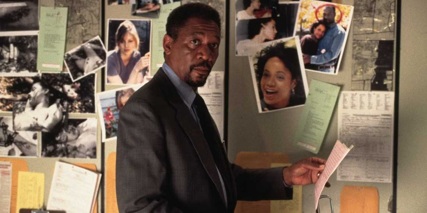 Morgan Freeman as Alex Cross looking at pictures in Kiss the Girls