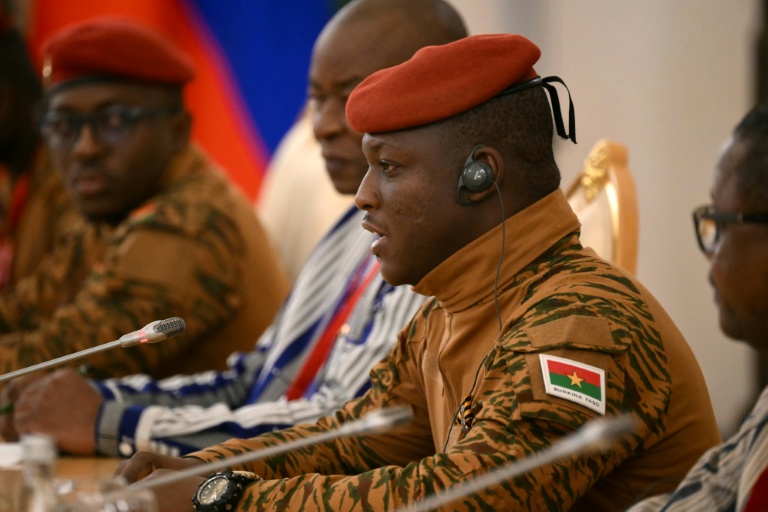Traore (R) threatened anyone who dared to challenge his rule, saying: 'I'll take you down.'