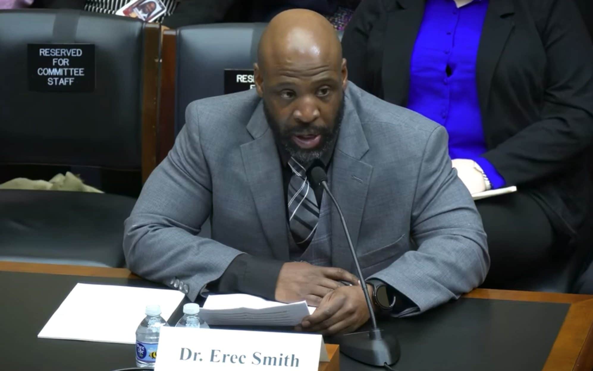 Erec Smith at a microphone testifying in front of a US House of Representatives committee in March 2024