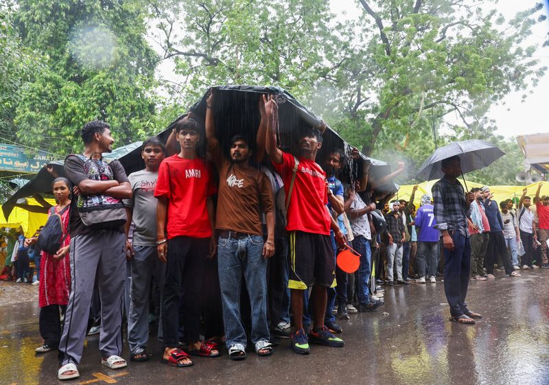 Supporters of India's Cockroach Janta Party (CJP) demonstrate at a protest site in New Delhi
