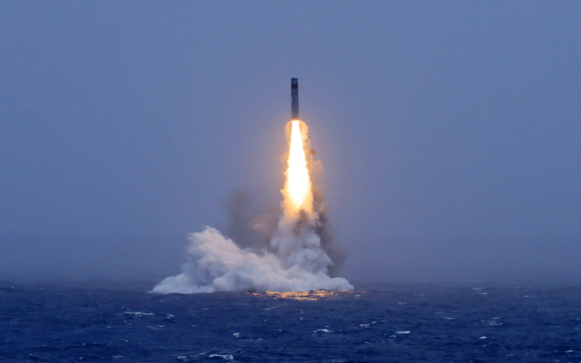 A long-range ballistic missile bursts out of the sea during a test launched from a Chinese nuclear-powered submarines in the South Pacific on Monday, July 6, 2026