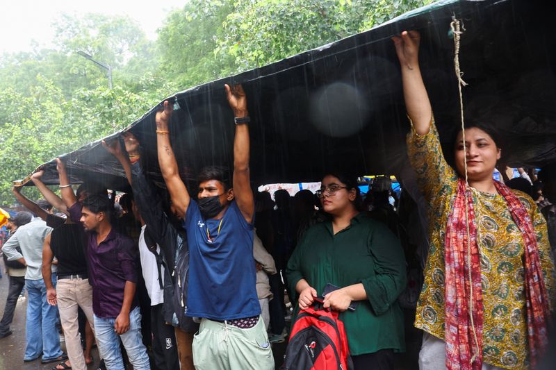 Supporters of India's Cockroach Janta Party (CJP) demonstrate at a protest site in New Delhi