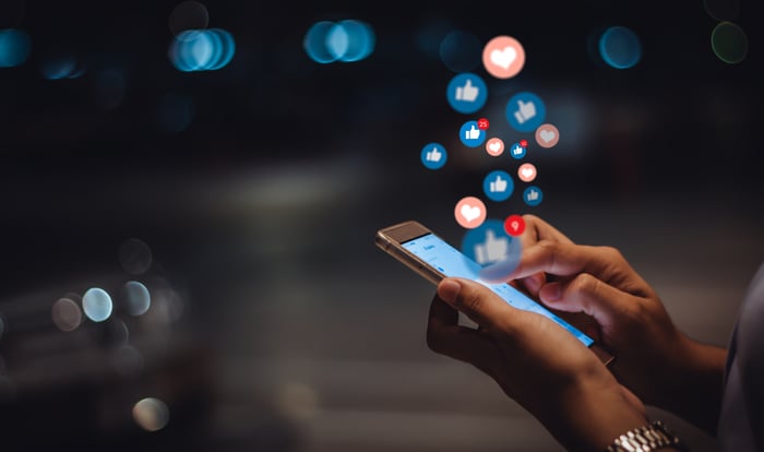 Icons coming out of a smartphone