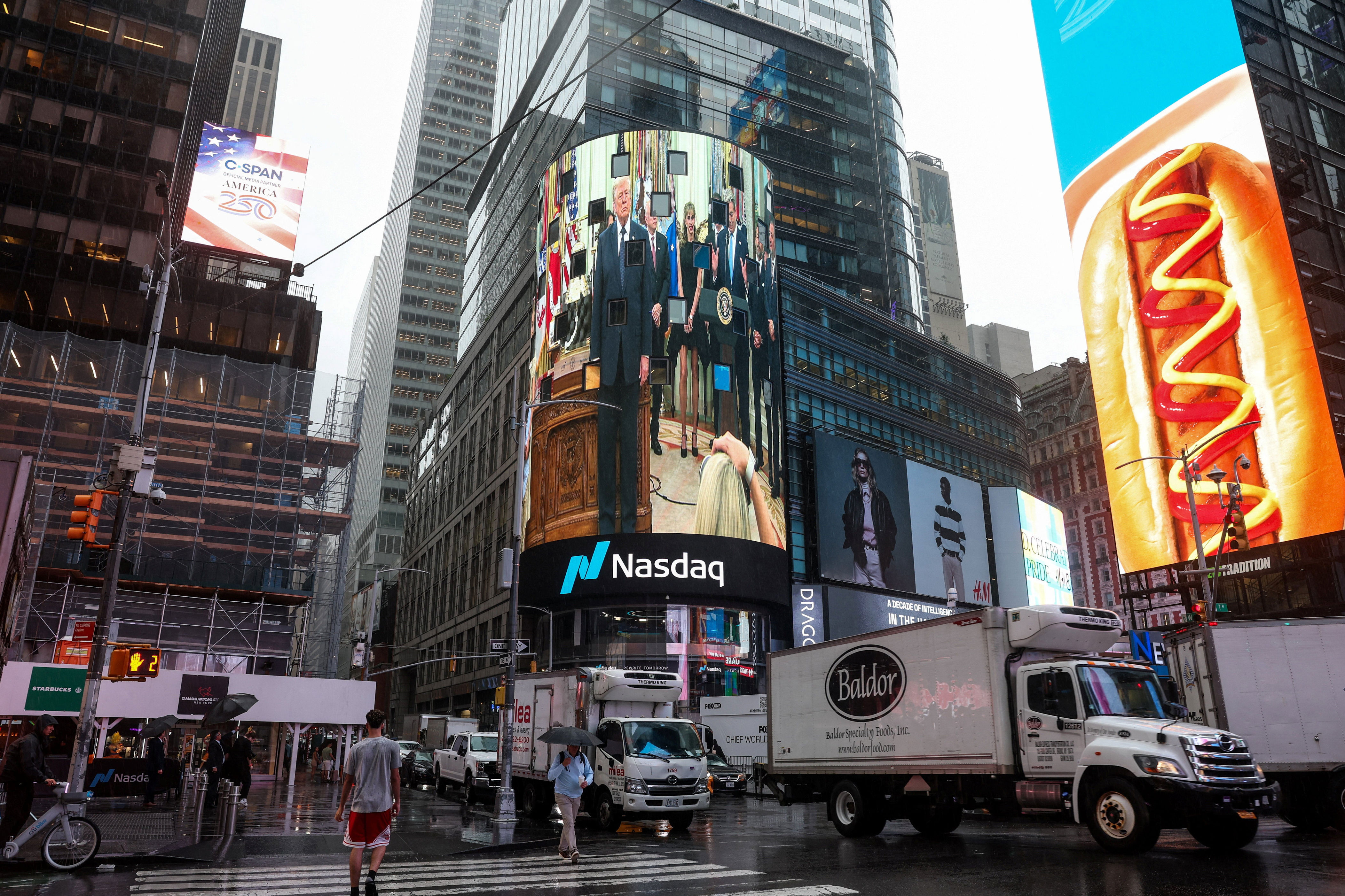 Trump appears on a screen at the Nasdaq MarketSite during a live stream, on the day he rings the opening bell for the New York Stock Exchange (NYSE) and Nasdaq during an event at the White House to mark the launch of