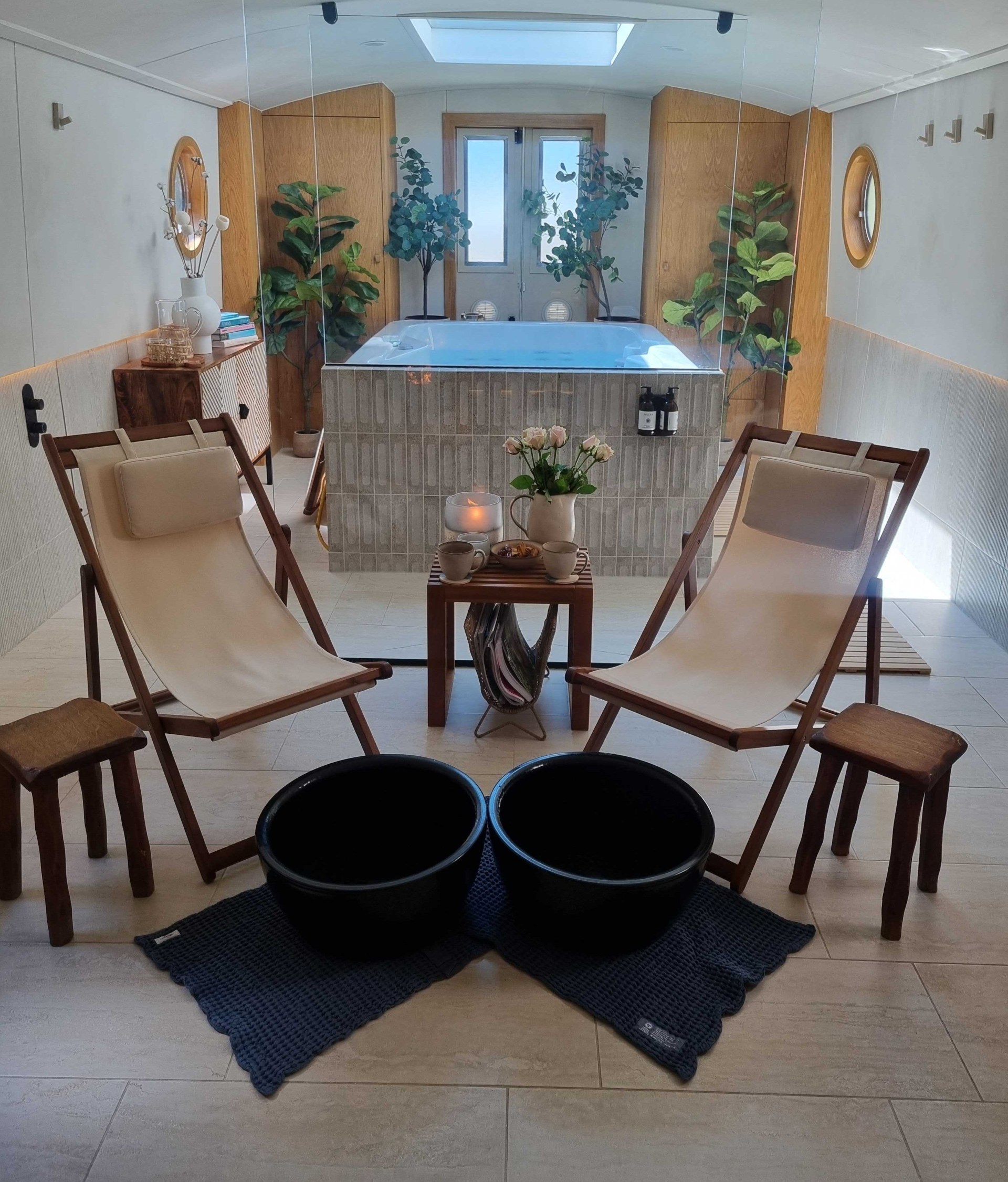 The interior of the boat, complete with two deck chairs and a hot tub