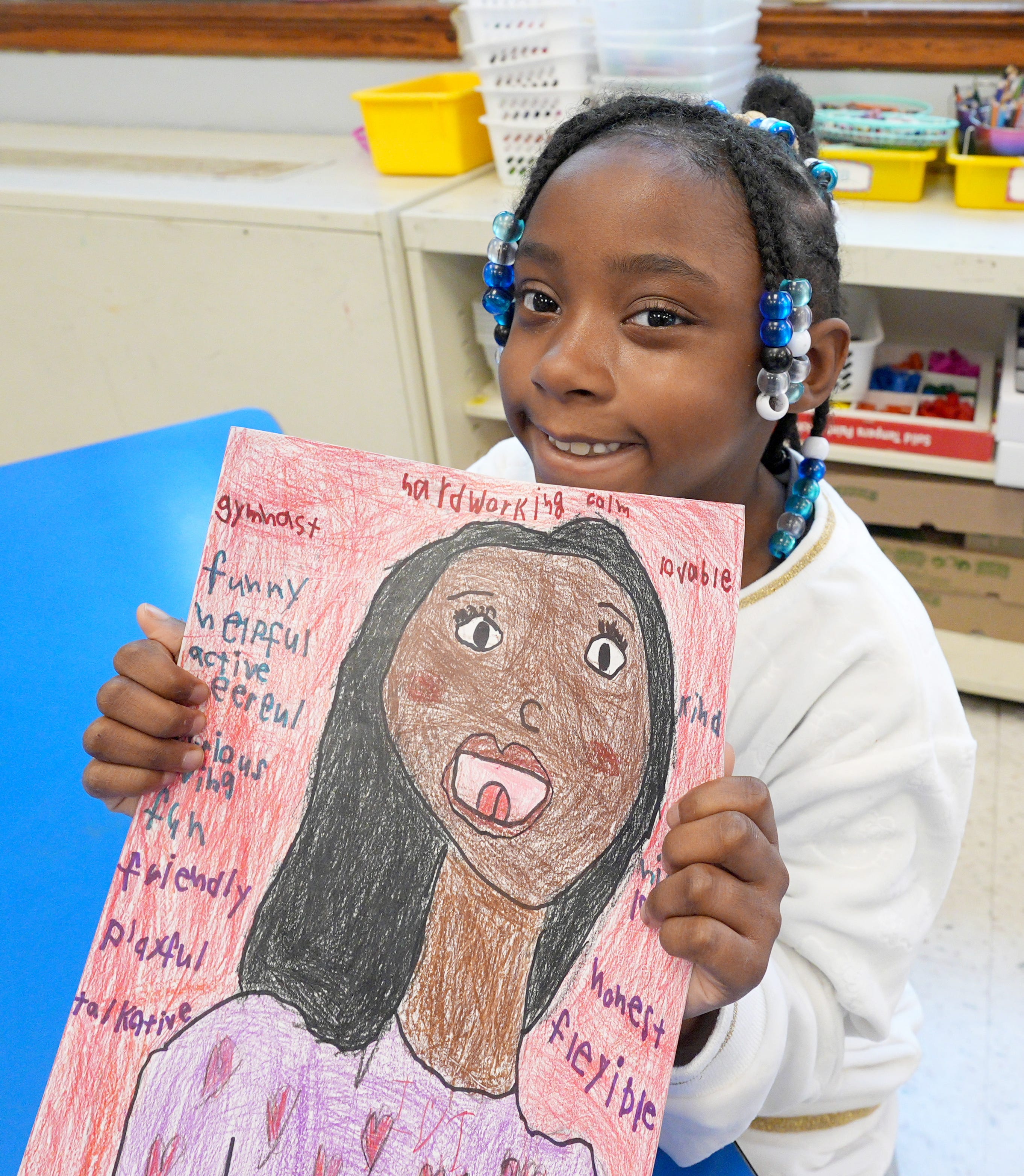 Second-grader Kayla shows the self-portrait she made in art class at Sloatsburg Elementary May 5, 2026.