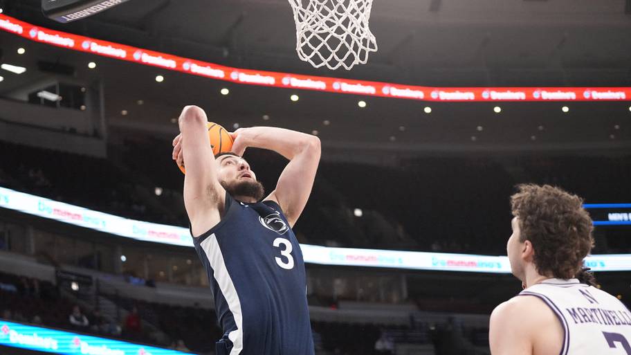 Penn State Nittany Lions forward Ivan Juric (3) dunks the ball on Northwestern Wildcats forward Nick Martinelli (2).