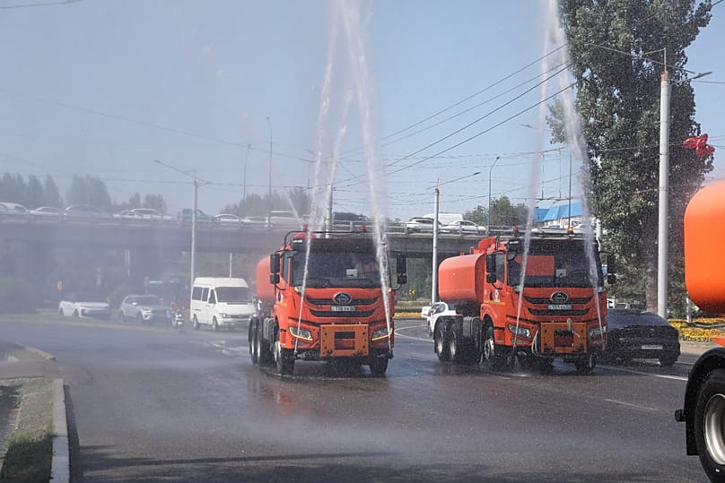 Almaty stepped up street watering and misting operations during the extreme heat.