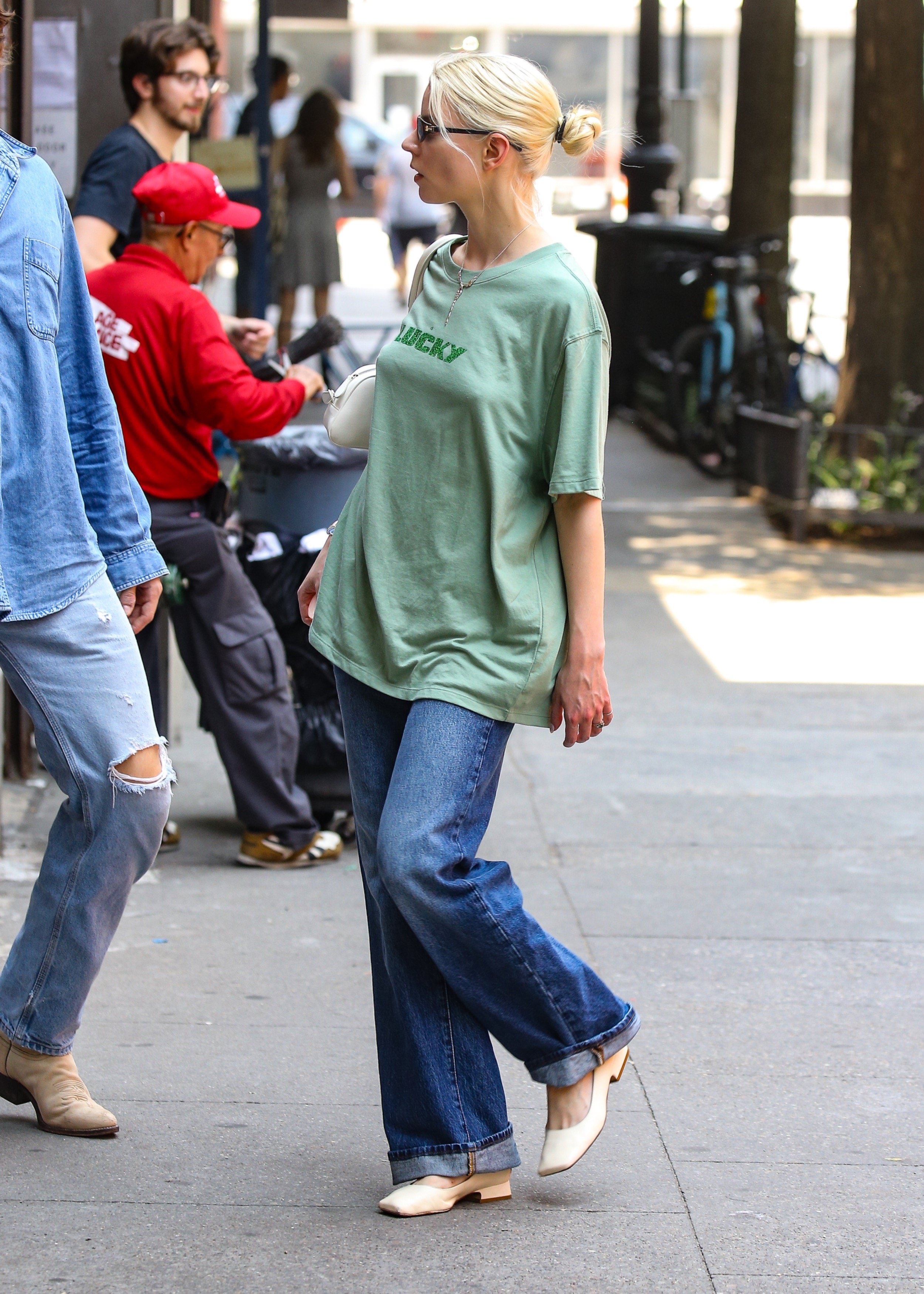 Anya Taylor-Joy was spotted enjoying a low-key day in New York City, keeping it casual in an oversized green graphic tee, relaxed jeans, Tiffany & Co. jewelry, and sunglasses.