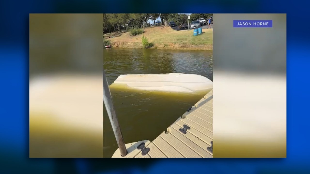Capsized boat in shallow water