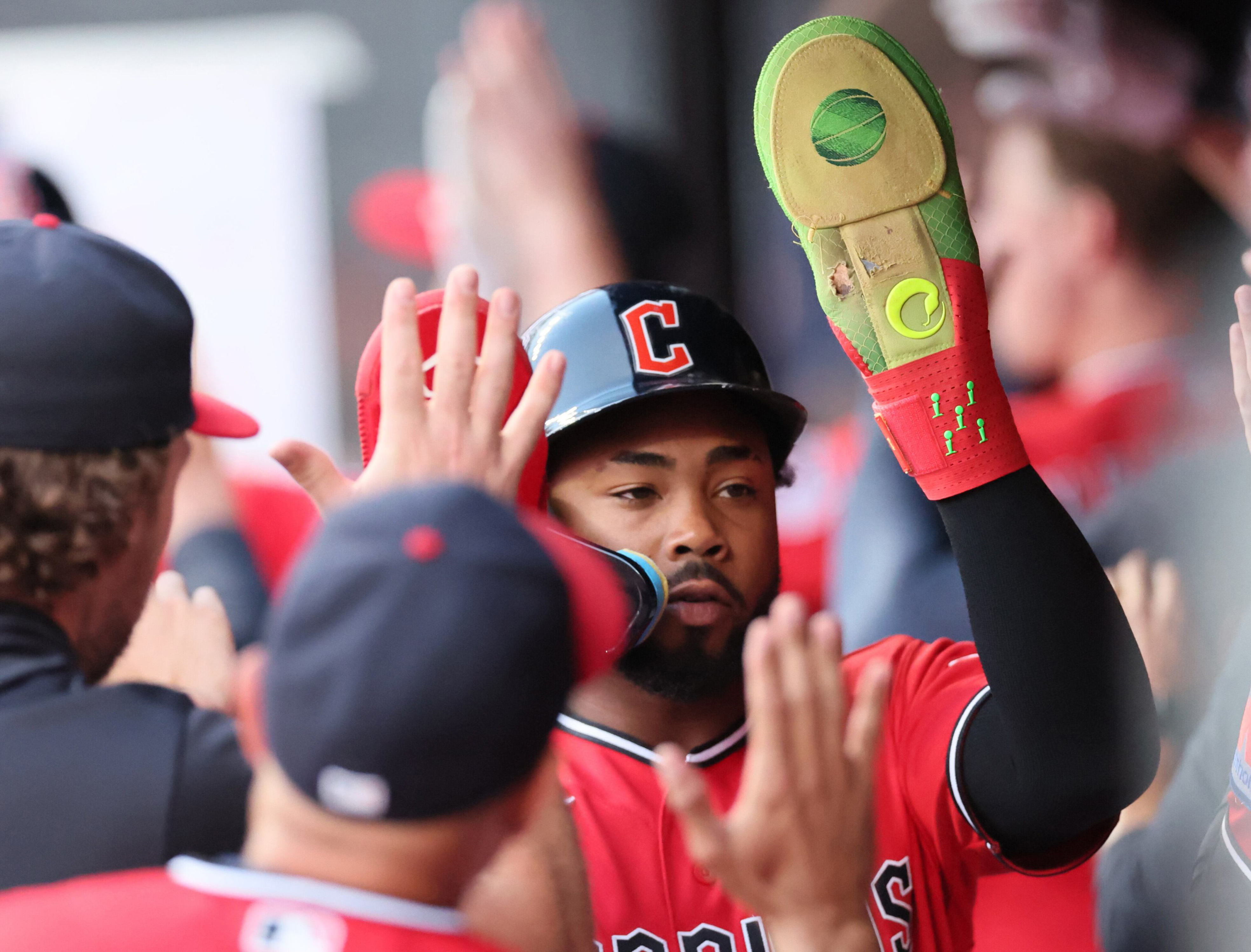 Cleveland Guardians pinch hitter Kahlil Watson is congratulated in the dugout after scoring in the sixth inning.