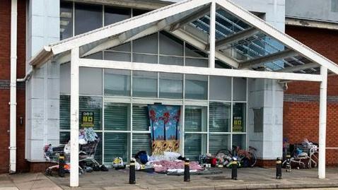 Rough sleepers in an empty shop doorway in Hanley in May.