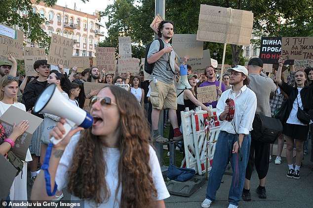 Ukrainians attend a rally to protest President Volodymyr Zelensky's decision to dismiss Defense Minister Mykhailo Fedorov, July 17