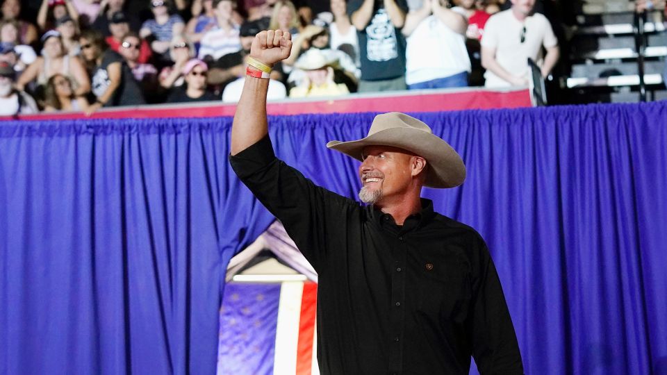 Pinal County sheriff Mark Lamb waves to a cheering crowd at a political rally in Prescott, Arizona, in July 2022. - Ross D. Franklin/AP