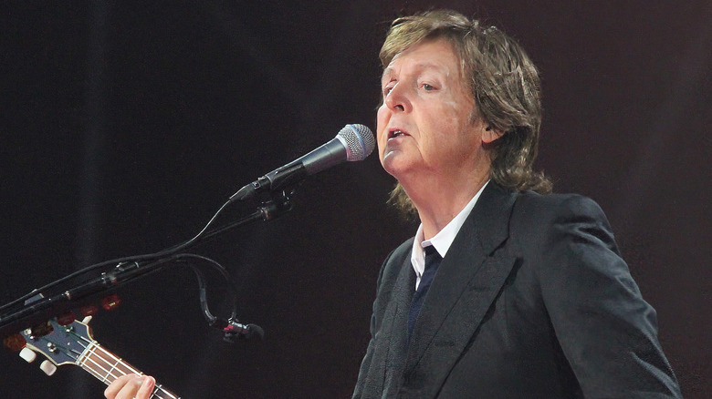 Paul McCartney playing bass and singing