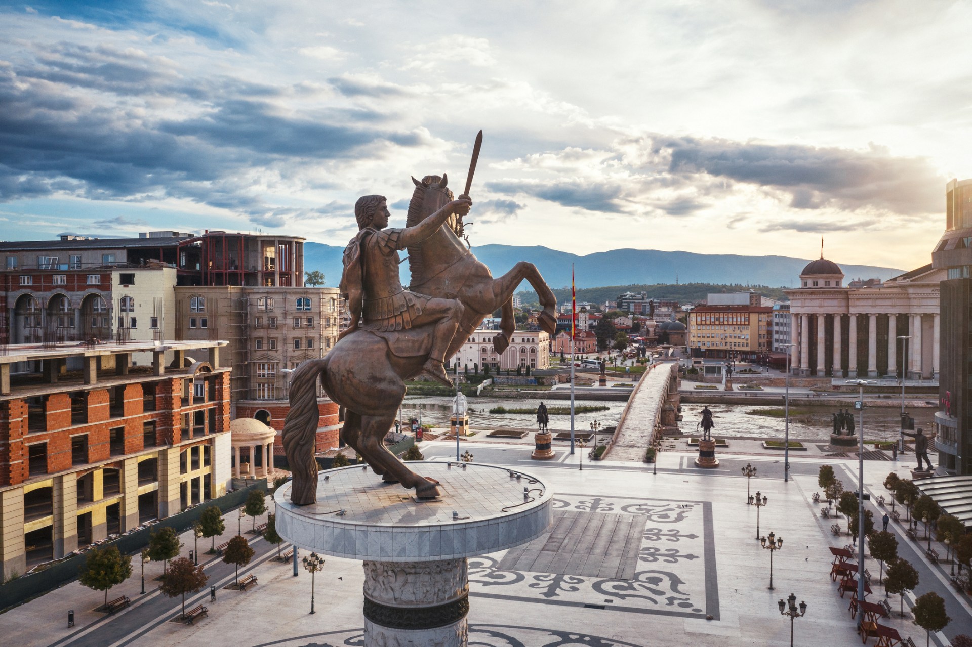 The Warrior on a Horse monument overlooking a square in Skopje, North Macedonia, on an overcast day.