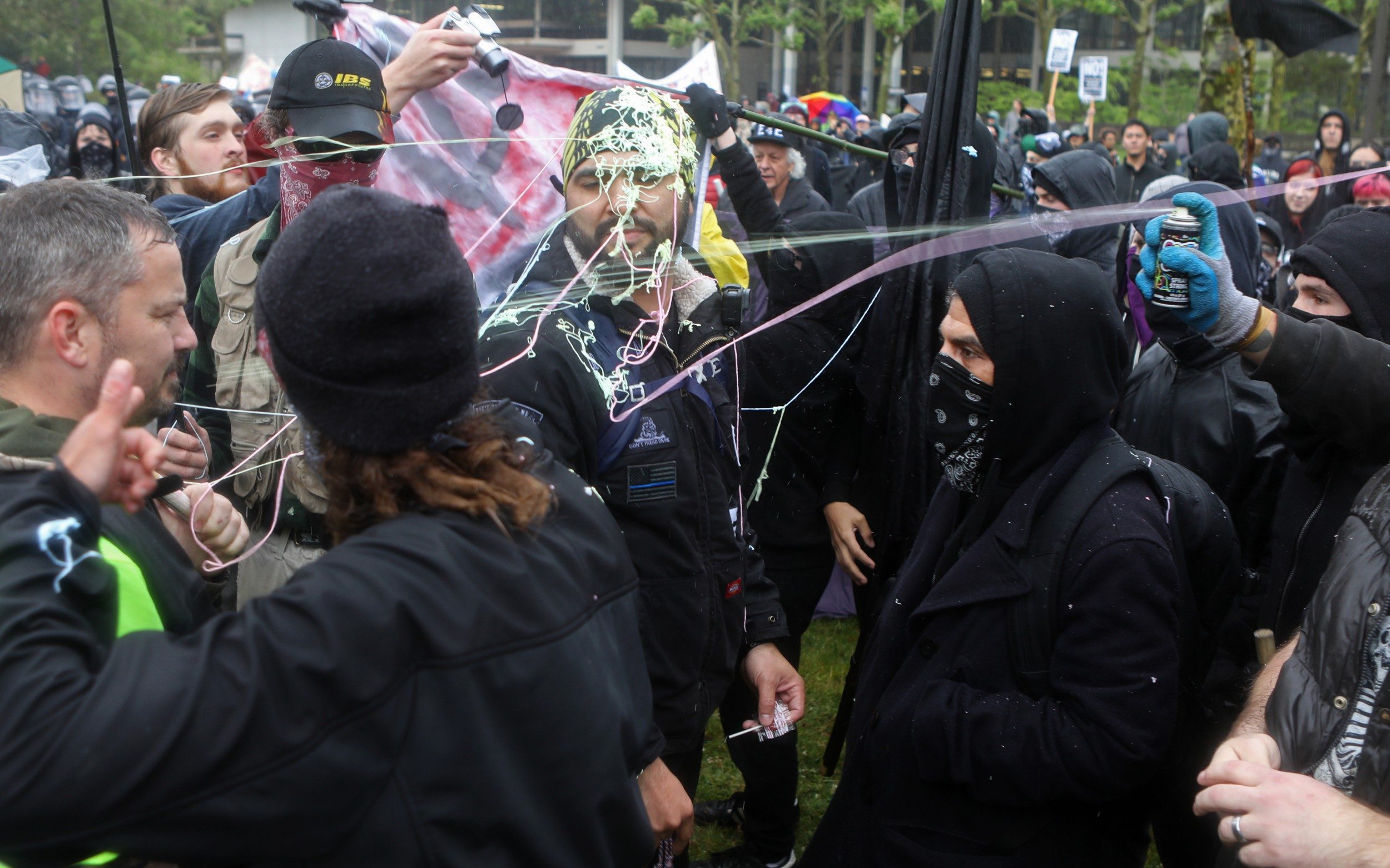 Counter-protesters spraying silly string on Right-wing demonstrators