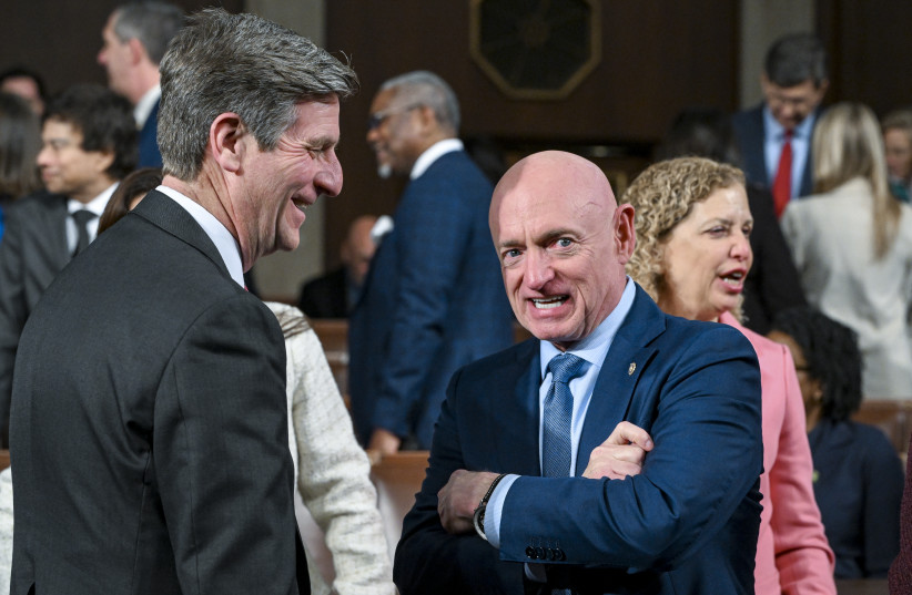 US Sen. Mark Kelly (D-AZ) (R) and Rep. Greg Stanton (D-AZ) talk about prior to President Donald Trump delivering the State of the Union address during a joint session of Congress at the Capitol on February 24, 2026 in Washington, DC. (credit: Kenny Holston-Pool/Getty Images)