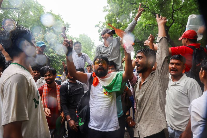 Supporters of India's Cockroach Janta Party (CJP) demonstrate at a protest site in New Delhi