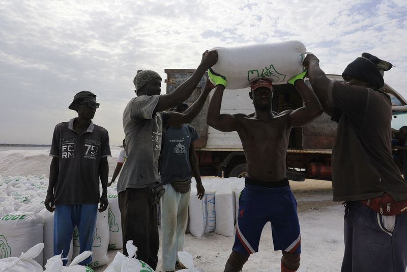 Salt workers return to Senegal's Pink Lake after years of disruption