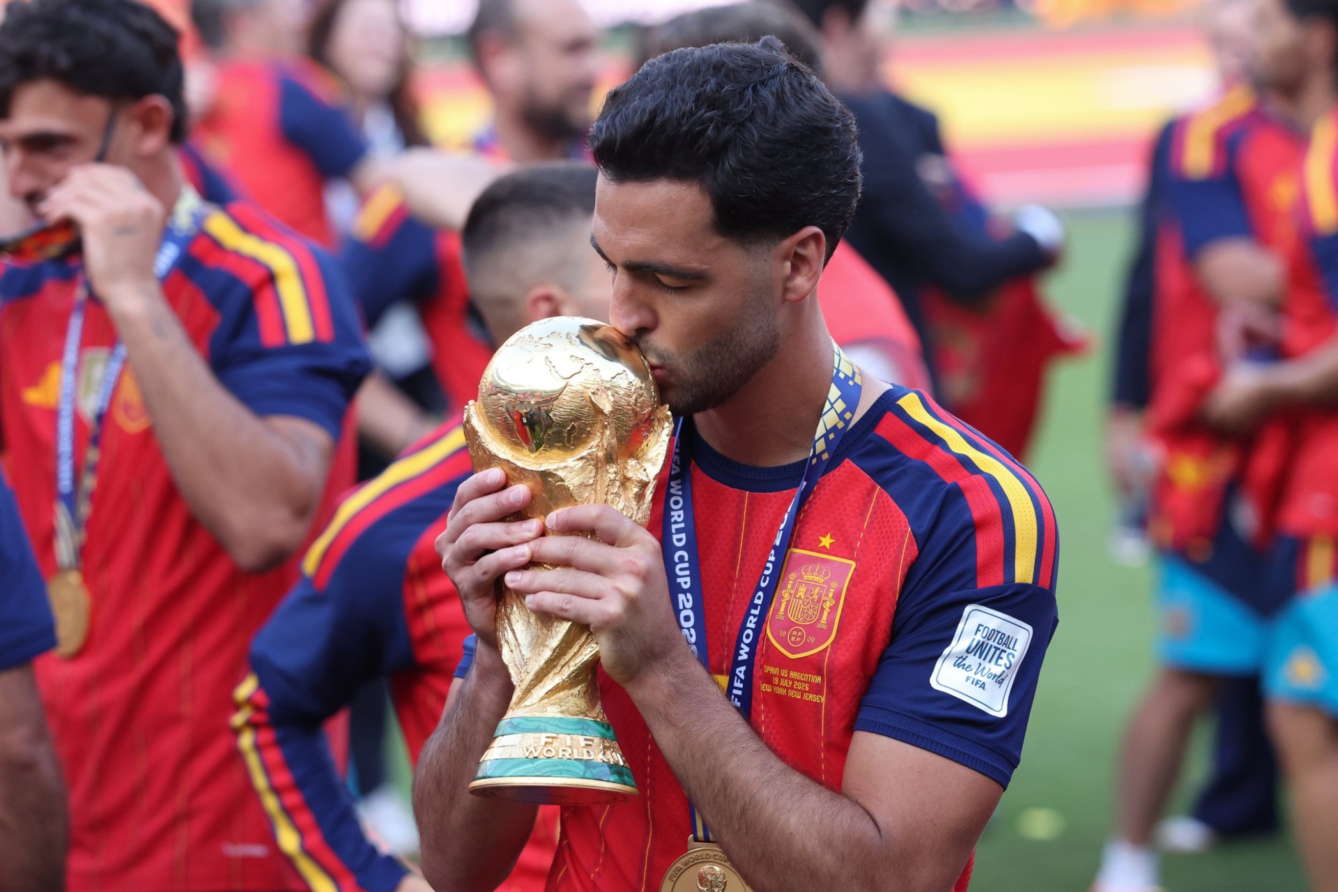 EAST RUTHERFORD, NEW JERSEY - JULY 19: Mikel Merino of Spain celebrates with the FIFA World Cup trophy after the FIFA World Cup 2026 Final match between Spain and Argentina at New York New Jersey Stadium on July 19, 2026 in East Rutherford, New Jersey. (Photo by Alex Livesey - Danehouse/Getty Images)