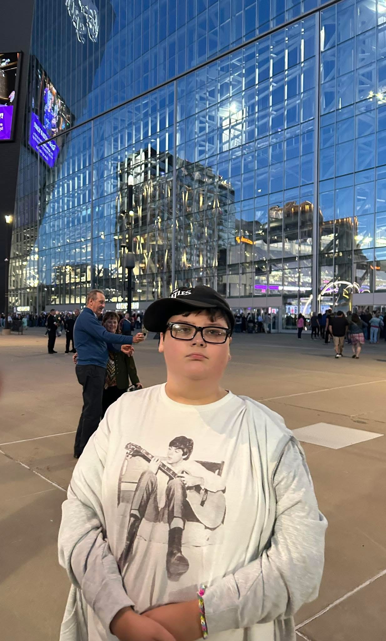 Aiden Levy in a Paul McCartney shirt and Beatles hat