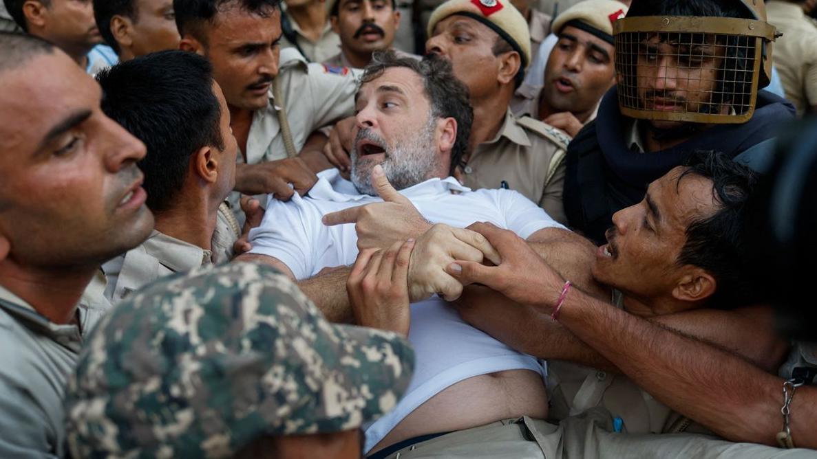 Police dragged Congress leader Rahul Gandhi and put him in a bus after he staged a protest outside Modi's house
