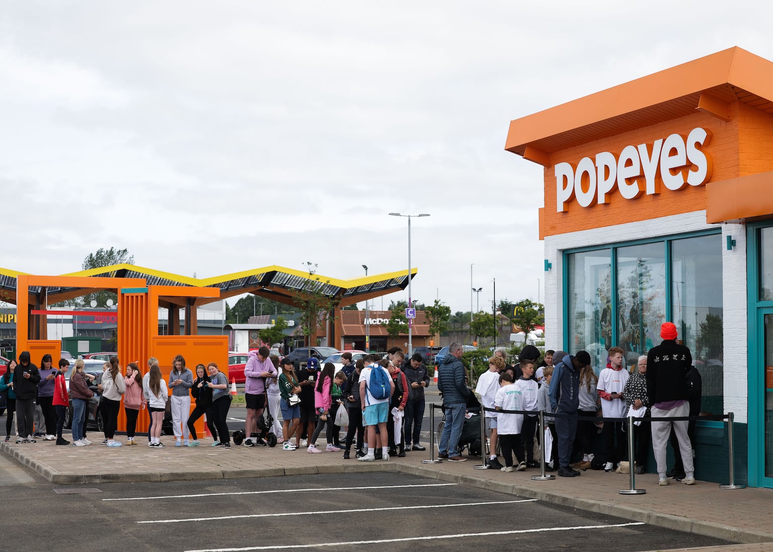 Customers queue outside Popeyes ahead of its opening at The Junction in Antrim last summer.